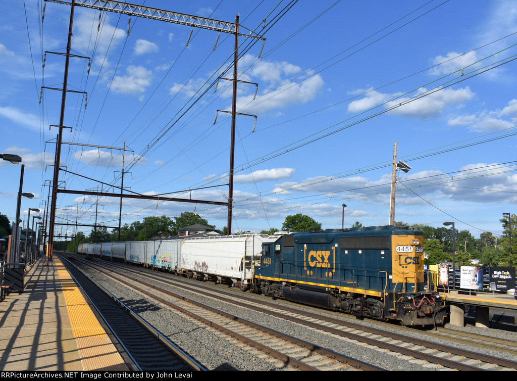 A CSX Unit pushing the Local freight past the Edisom Station-same train with the Conrail Caboose leading